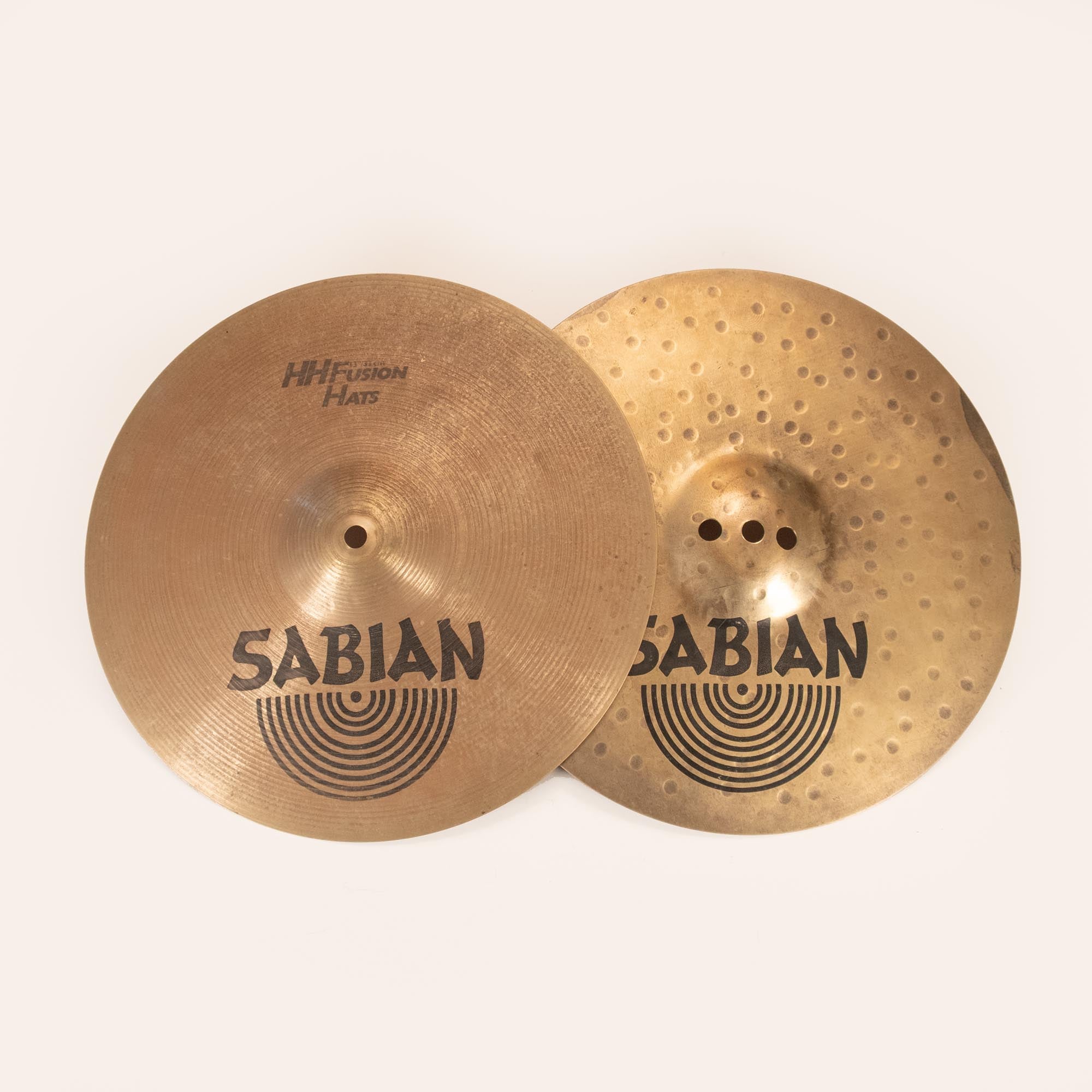 Zildjian Sabian 13-inch HH Fusion Hi-Hat cymbal set, preowned, showing the hi-hat cymbals with detailed surface texture and branding.