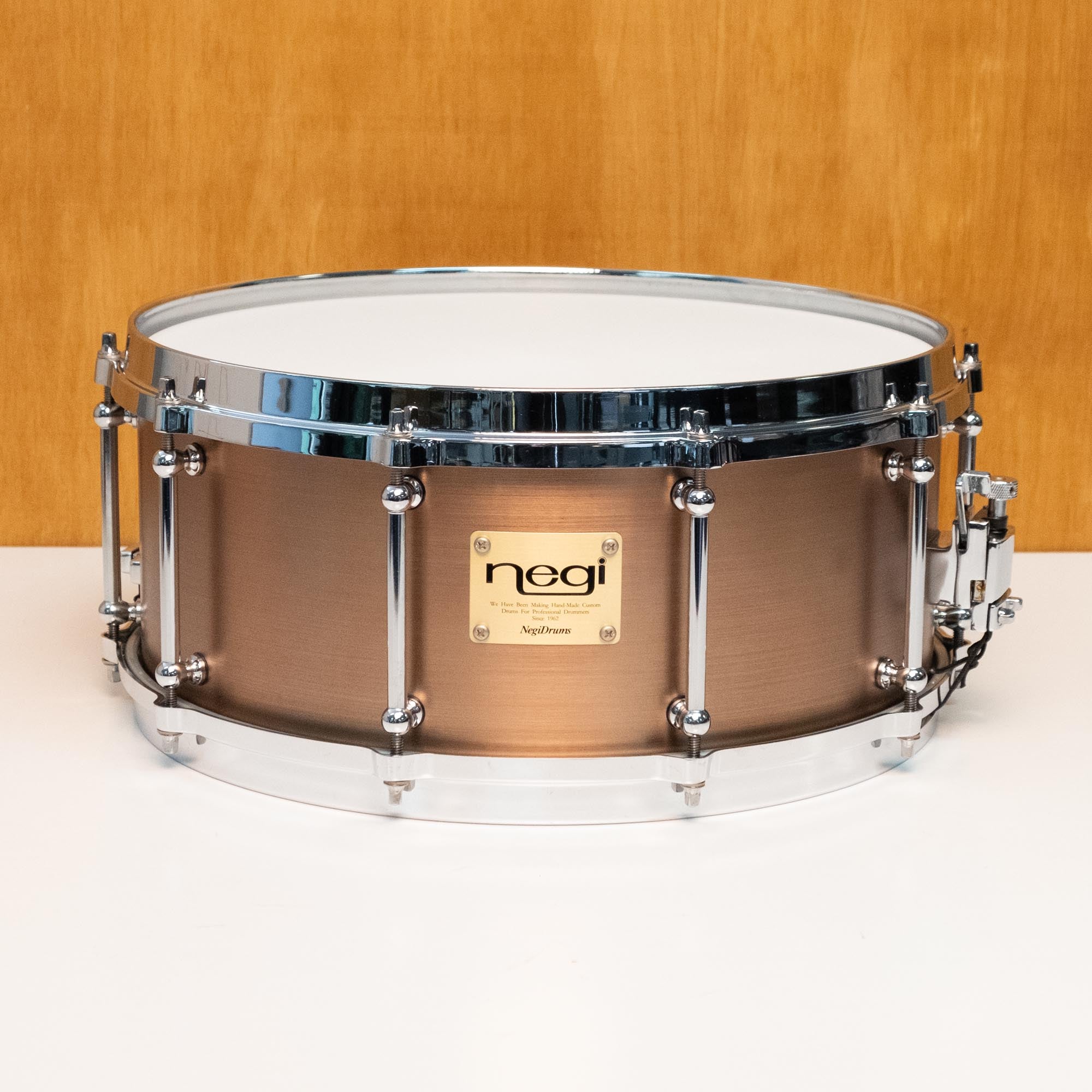 Negi Drums 14x6 steel snare drum in rust finish, vintage MIJ model, showing the drum's textured surface and hardware details.