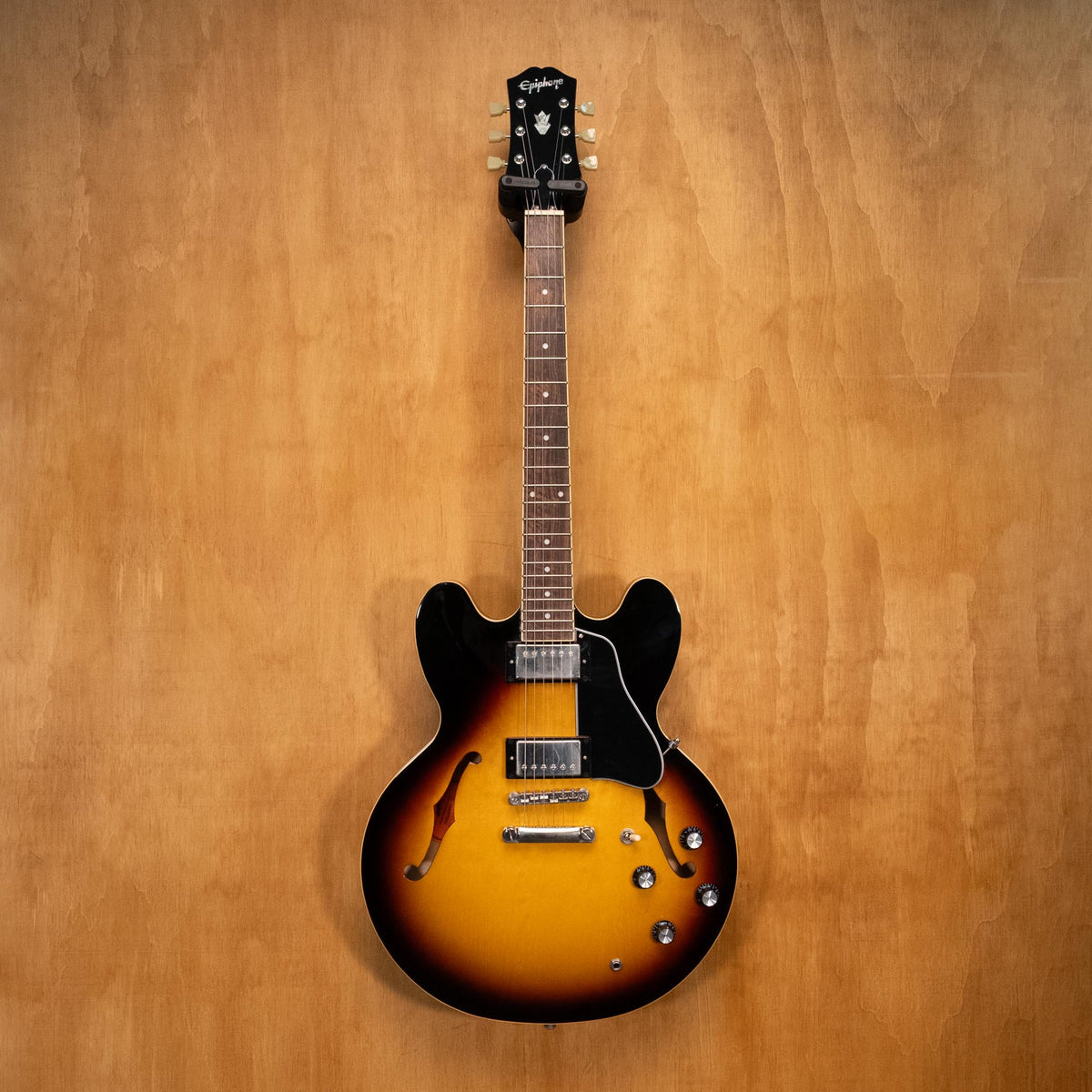 Preloved Epiphone Inspired By Gibson ES-335 electric guitar with vintage burst finish, showing its double-cutaway body and classic hardware.