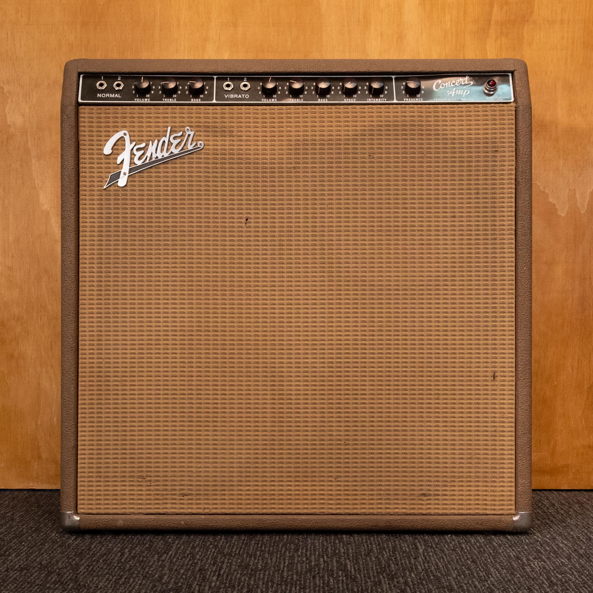 Fender 1963 Concert 6G12-A brownface 40-watt guitar amplifier combo with four 10-inch speakers, vintage design and control panel.