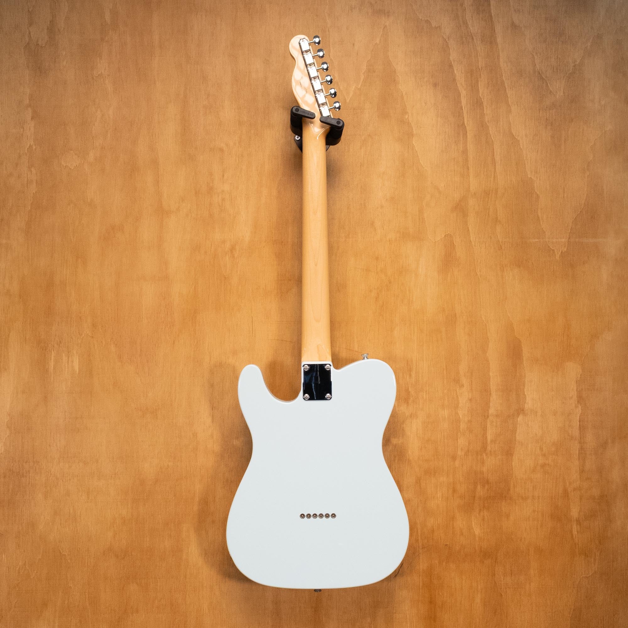 Fender Traditional II 60s Telecaster electric guitar in Sonic Blue with maple neck and vintage-style hardware, close-up of body and pickups