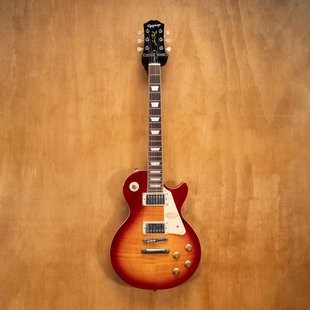 Epiphone Les Paul Standard '50s electric guitar in Heritage Cherry, showcasing its solid body, humbucker pickups, and vintage finish.