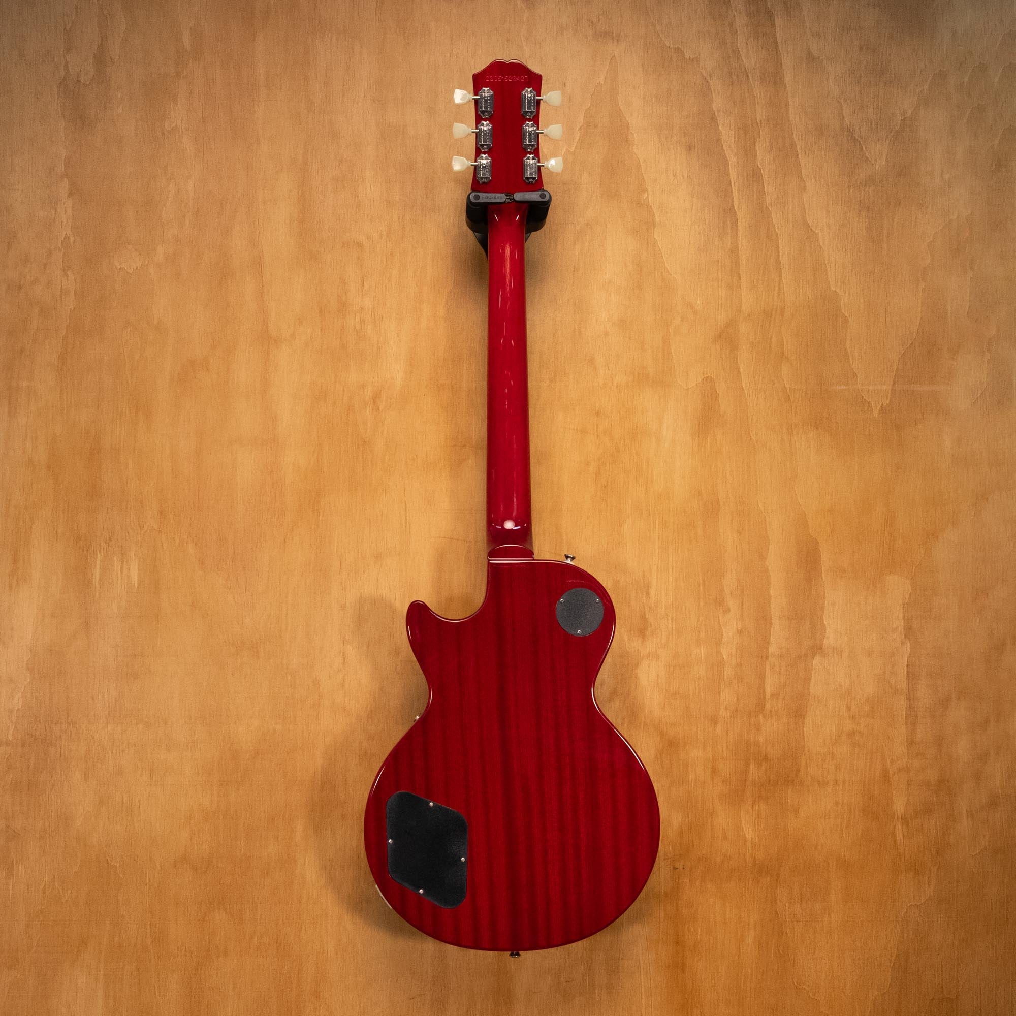 Epiphone Les Paul Standard '50s electric guitar in Heritage Cherry, showing the solid body, vintage finish, and chrome hardware.