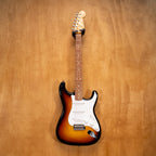 Fender Stratocaster ST62-US electric guitar with 3-tone sunburst finish and maple neck, displayed against a neutral background.