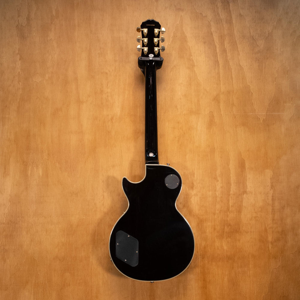Epiphone Les Paul Custom Plus electric guitar in vintage sunburst finish with gold hardware, shown from front view.