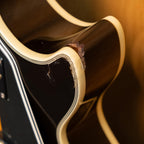 Epiphone Les Paul Custom Plus electric guitar with vintage sunburst finish, showcasing its body and neck details.