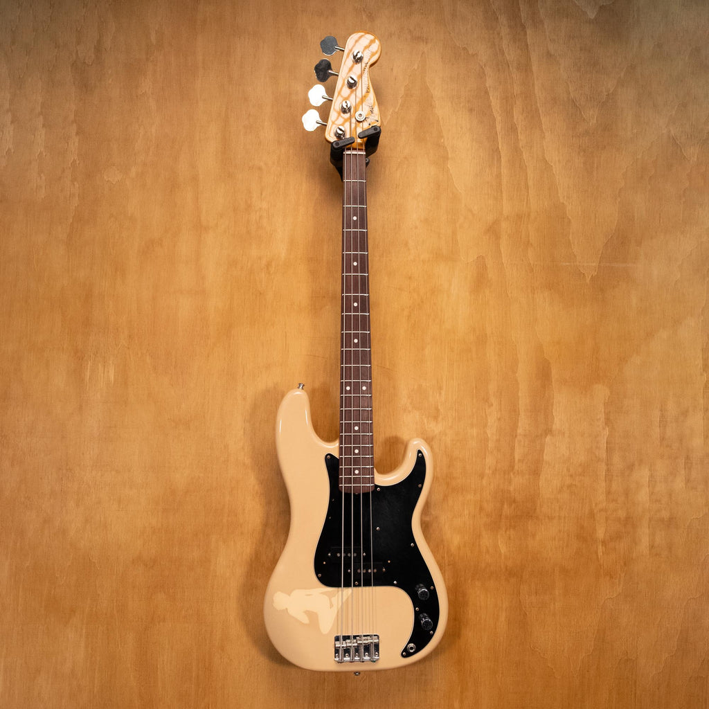 Fender Precision Bass PB70-70US in Olympic White with maple fingerboard, shown in a close-up view of the bass guitar.