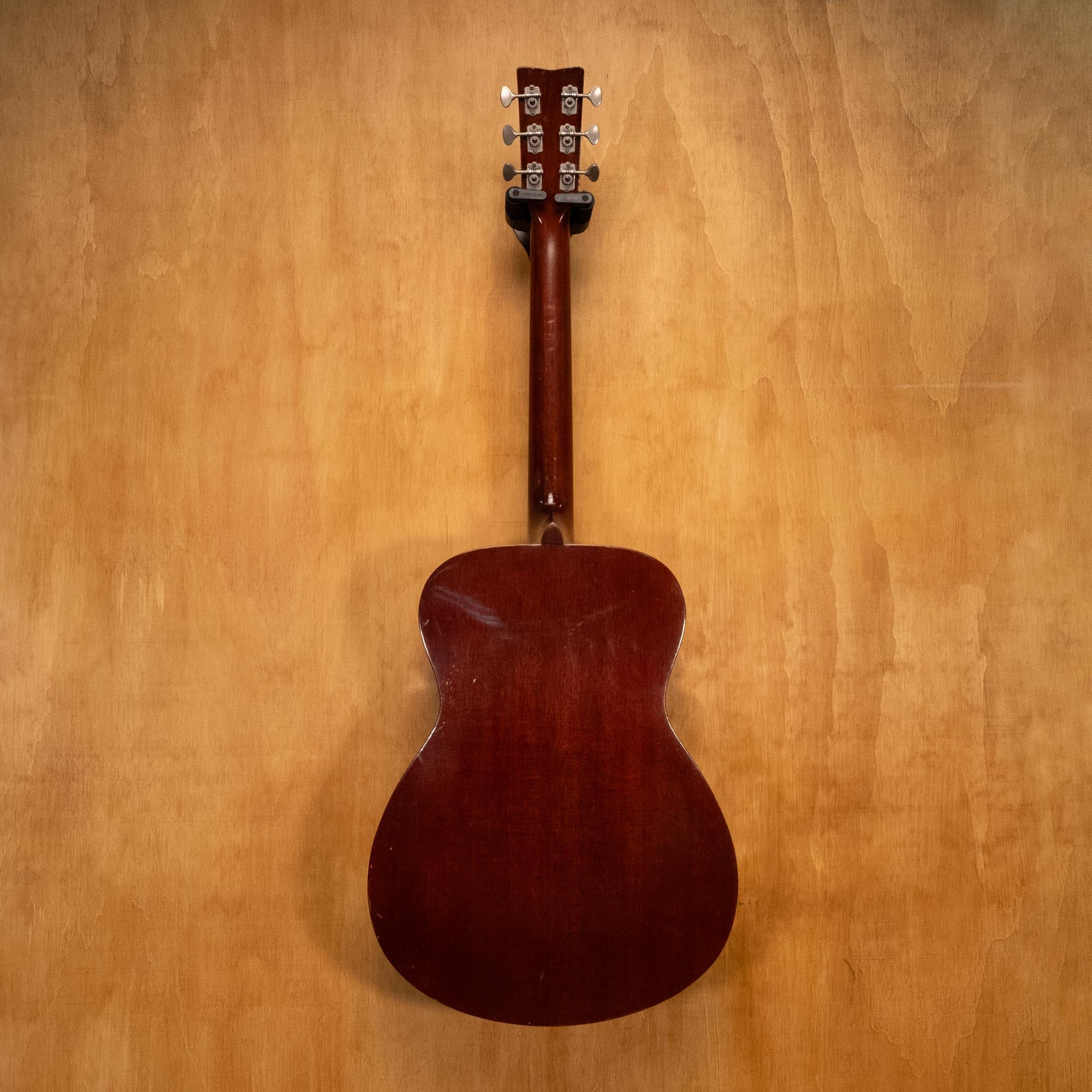 Yamaha FG-150 acoustic guitar, preowned, with natural wood finish, showcasing the body and strings in a close-up shot.