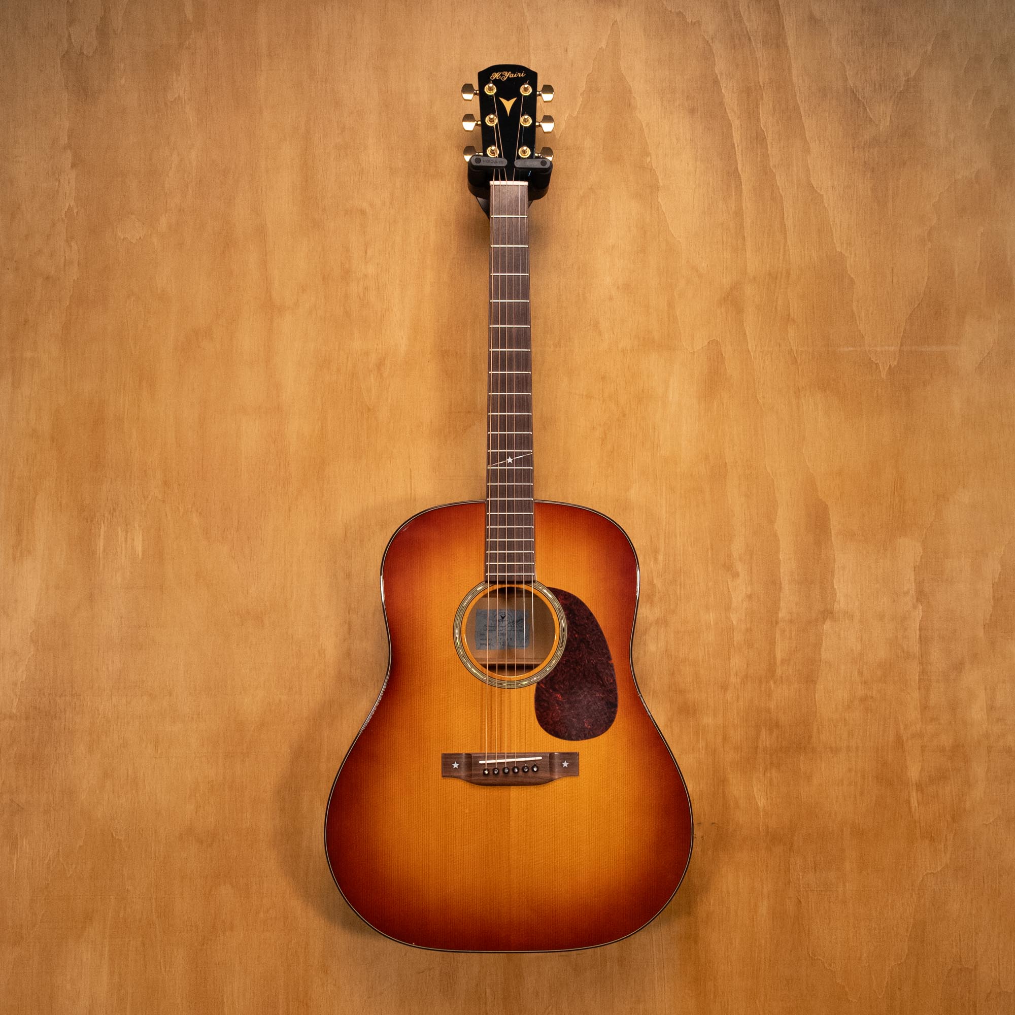 K. Yairi AY65 dreadnought acoustic guitar with sunburst finish, showcasing wood grain and popular guitar design.