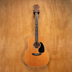 Martin D-35 dreadnought acoustic guitar with rich wood finish and six strings, shown in a close-up shot highlighting the body and fretboard.