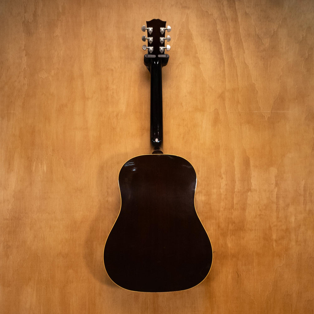 Gibson J-45 Standard acoustic guitar with sunburst finish, showing the body and fretboard of this vintage-style Gibson acoustic.