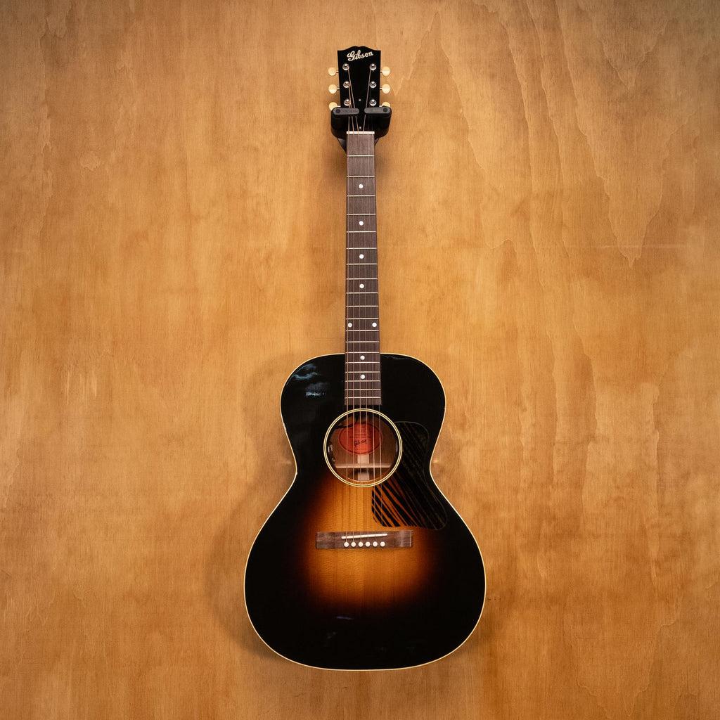 Gibson L-00 original acoustic guitar, preowned, showing the vintage wood body and fretboard, with tuning pegs and soundhole visible.