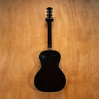 Gibson L-00 original acoustic guitar with a vintage finish, featuring a wooden body and six strings, displayed on a stand.