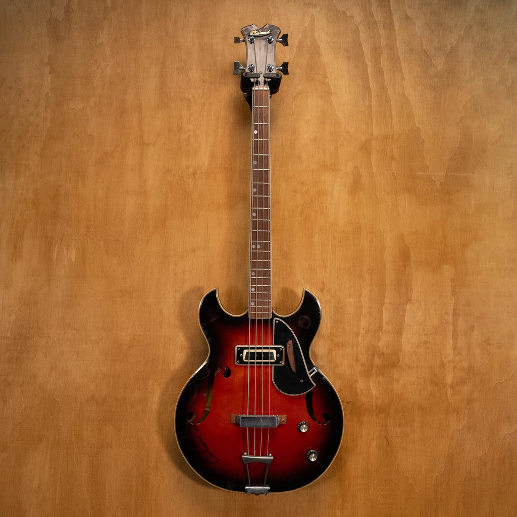 Preloved Aria Diamond Hollow Body Electric Bass guitar with sleek design and glossy finish, showcasing its elegant curves and hardware.