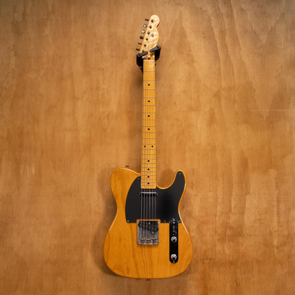 Fender Telecaster Crafted in Japan '04 electric guitar with sunburst finish and maple neck, close-up of body and control knobs.