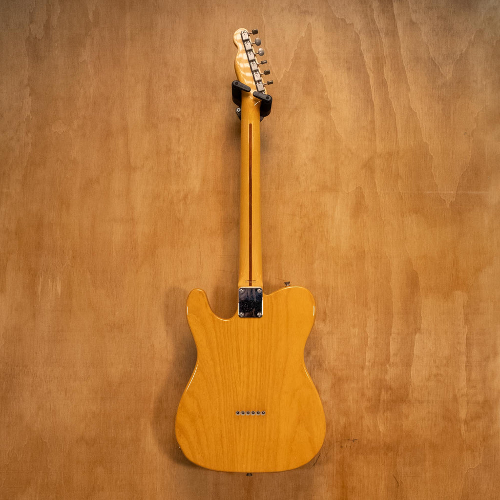 Fender Telecaster electric guitar crafted in Japan '04 with sunburst finish and chrome hardware, shown in a close-up view.