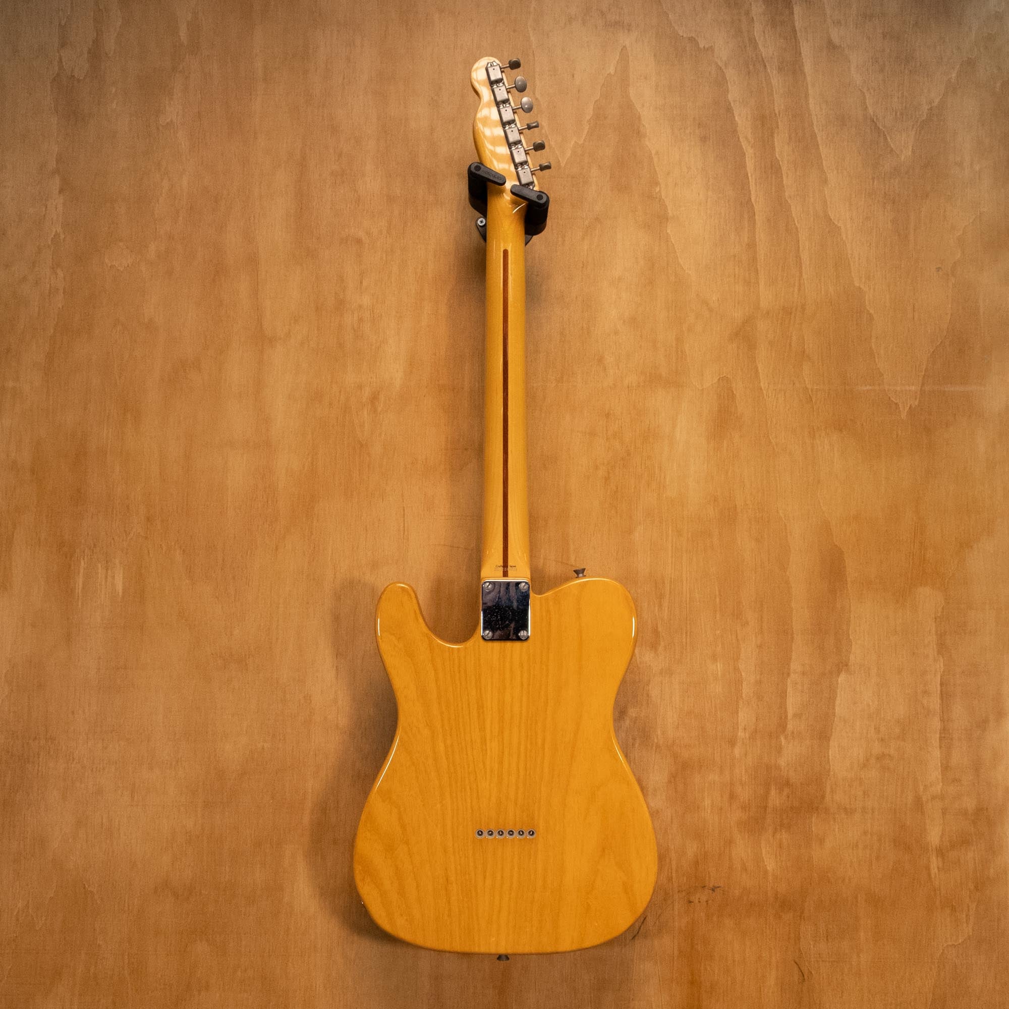 Fender Telecaster electric guitar crafted in Japan '04 with sunburst finish and chrome hardware, shown in a close-up view.