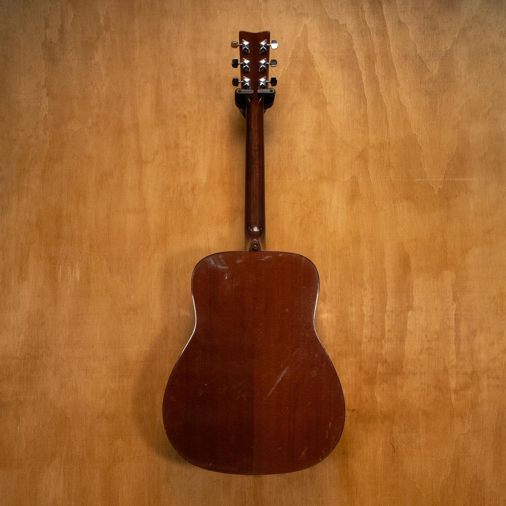 Yamaha FG410A acoustic guitar with natural wood finish, six strings, and dreadnought shape, shown in a close-up shot.