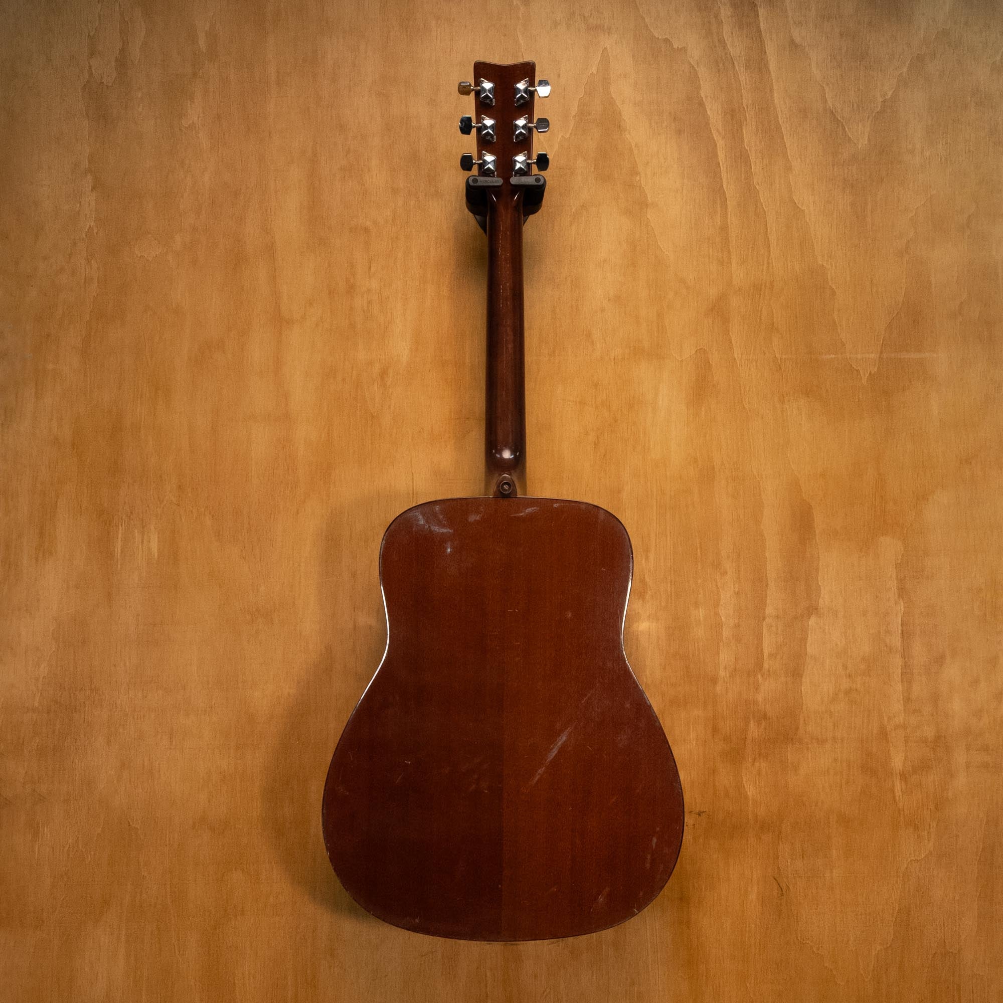 Yamaha FG410A acoustic guitar with natural wood finish, six strings, and dreadnought shape, shown in a close-up shot.