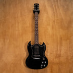 Preloved Gibson SG Standard Ebony electric guitar with double-cutaway body and humbucker pickups, shown in a close-up shot.
