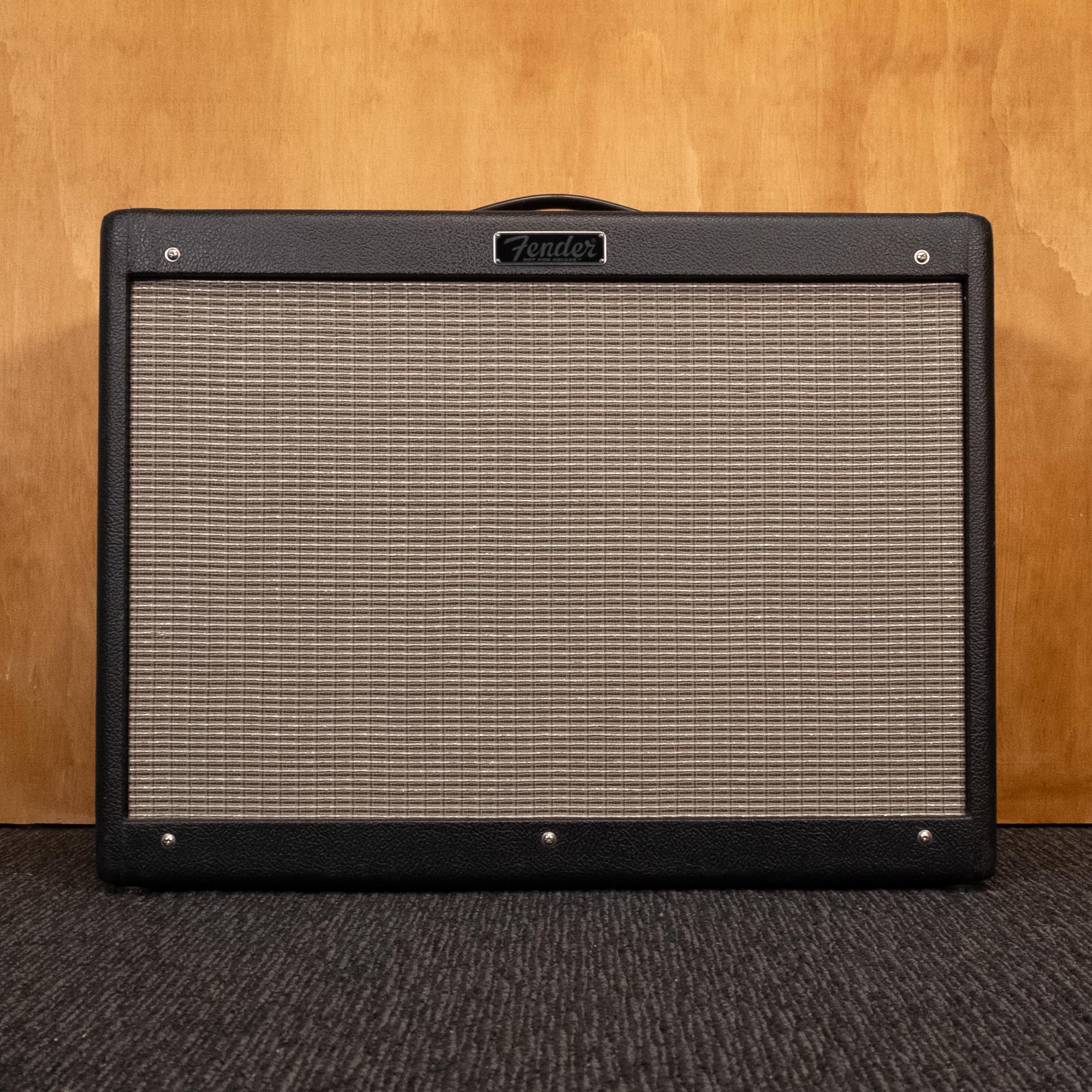 Fender Hot Rod Deluxe IV guitar amplifier combo with control knobs and speaker grill, black finish, front view.