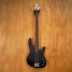 Black Cort Action PJ Bass Guitar with double cutaway body and four strings, shown from a front angle.
