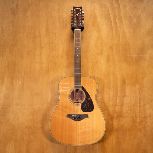 Yamaha FG720S-12 12-string acoustic guitar with a natural wood finish, six pairs of steel strings, and a classic dreadnought shape.