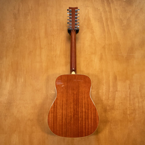 Yamaha FG720S-12 12-string acoustic guitar with natural wood finish, showcasing the body, neck, and headstock.