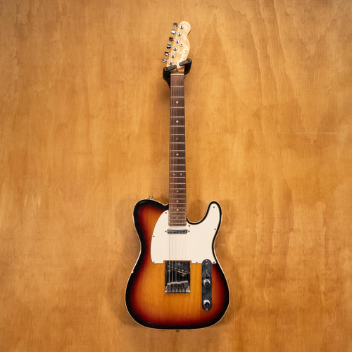 Fender USA Telecaster Deluxe electric guitar with sunburst finish, showcasing dual humbucker pickups and vintage-style hardware.