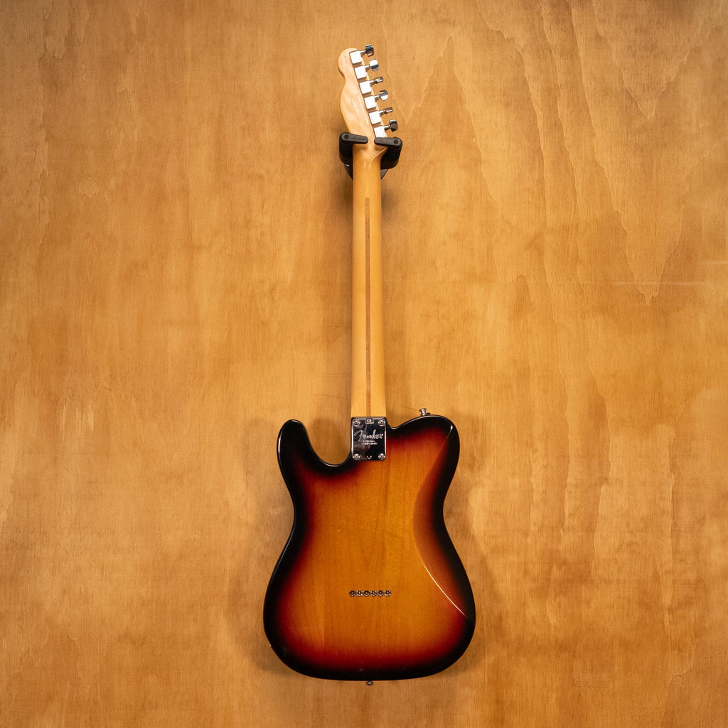 Fender USA Telecaster Deluxe electric guitar with sunburst finish, showing the iconic double-cutaway body and vintage pickups.