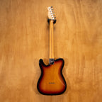 Fender USA Telecaster Deluxe electric guitar with sunburst finish, showing the iconic double-cutaway body and vintage pickups.