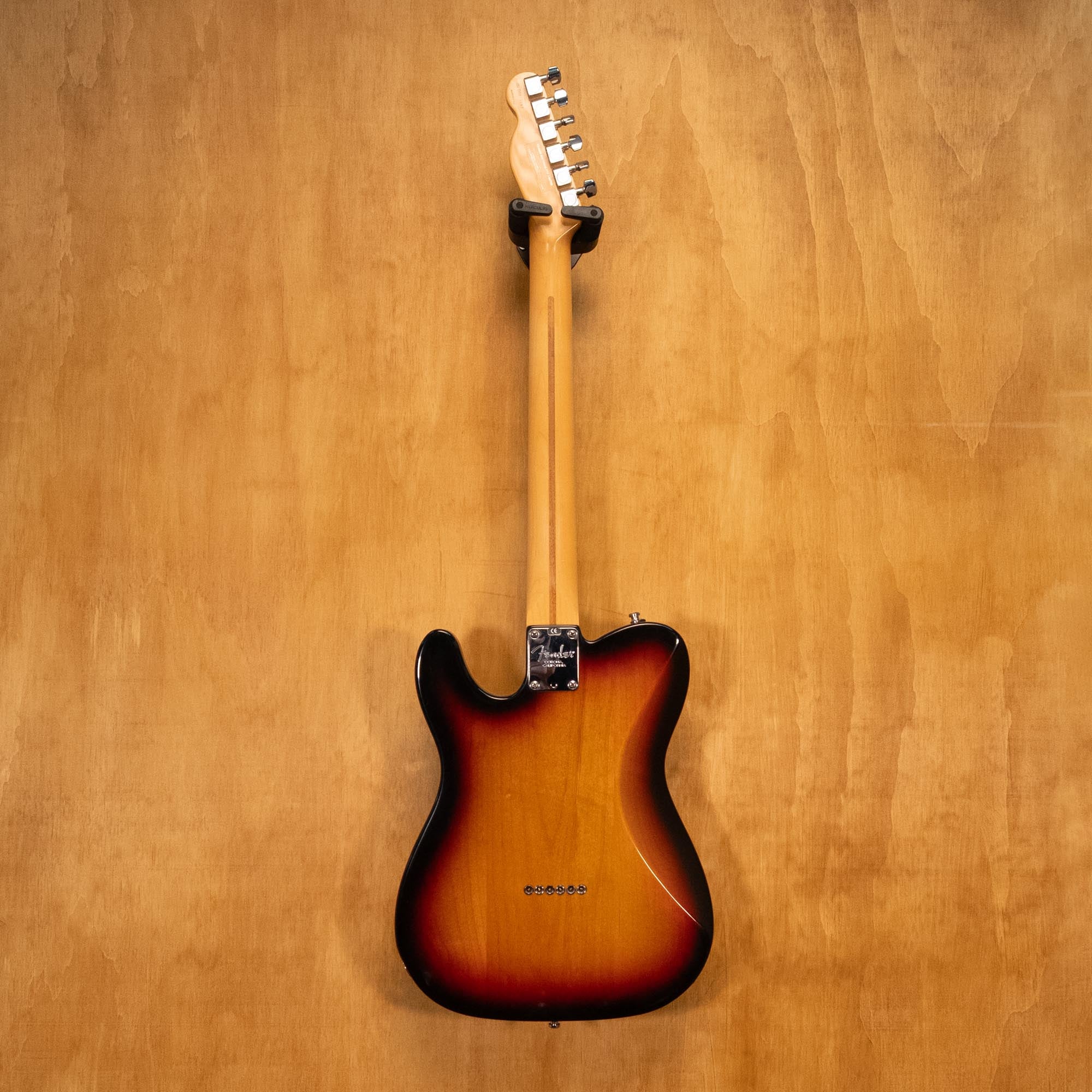 Fender USA Telecaster Deluxe electric guitar with sunburst finish, showing the iconic double-cutaway body and vintage pickups.