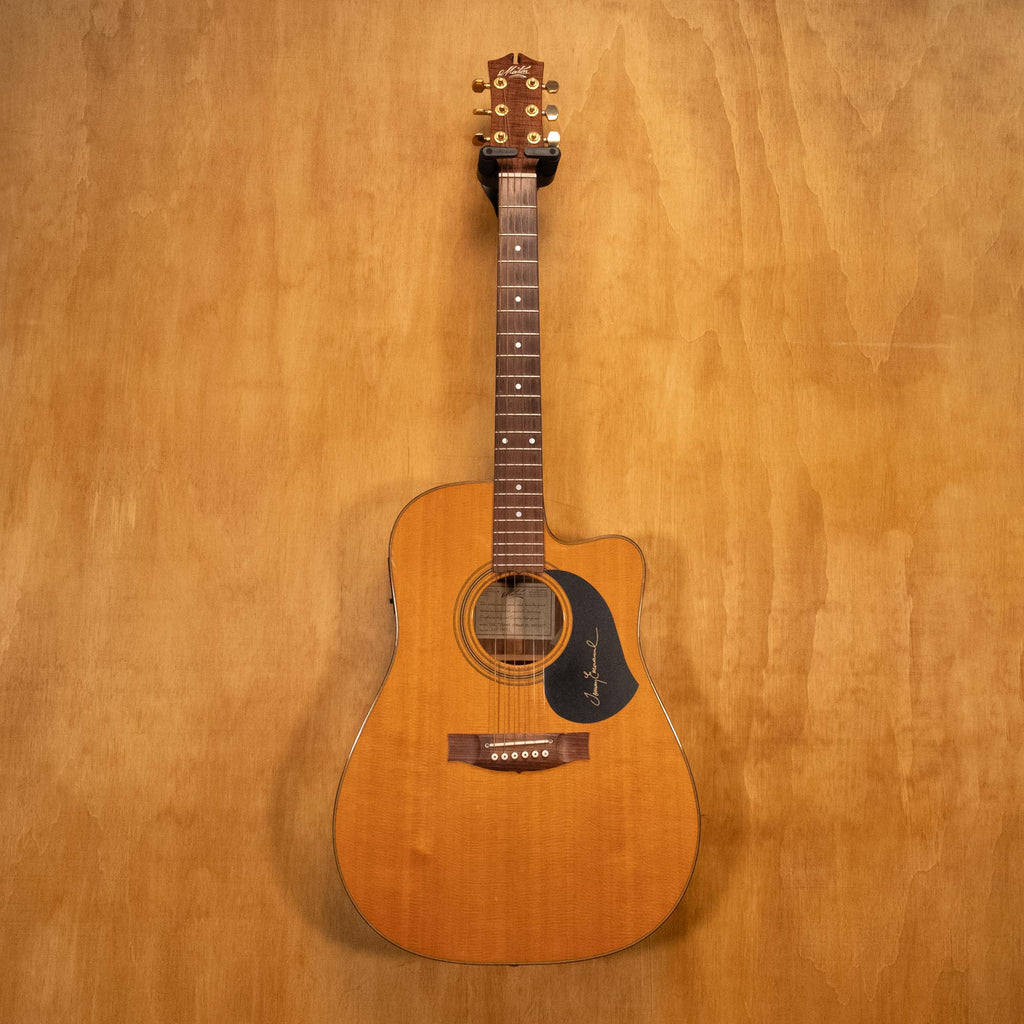 Maton Tommy Emmanuel TE1 acoustic guitar, preowned, showcasing its natural wood finish and detailed craftsmanship.