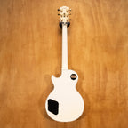 Gibson Les Paul Custom electric guitar in Alpine White, 2006 model, showing the body and neck with gold hardware details.
