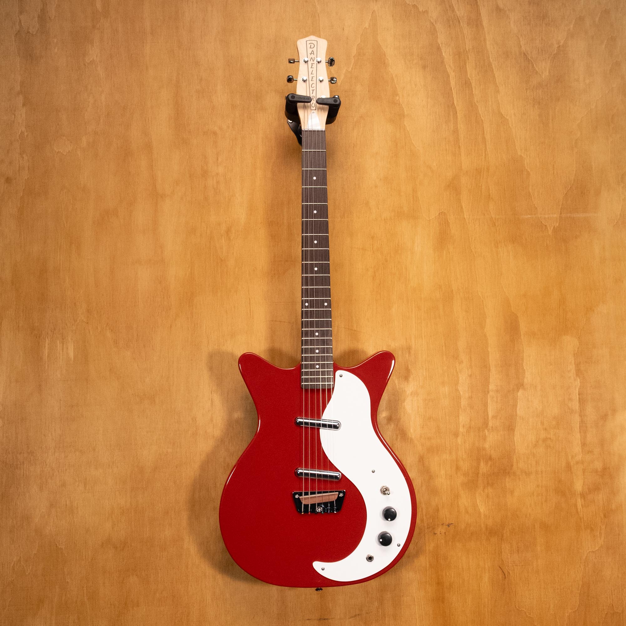 Danelectro Stock '59 Electric Guitar in red with chrome hardware, solid body and vintage style, shown on a plain background.
