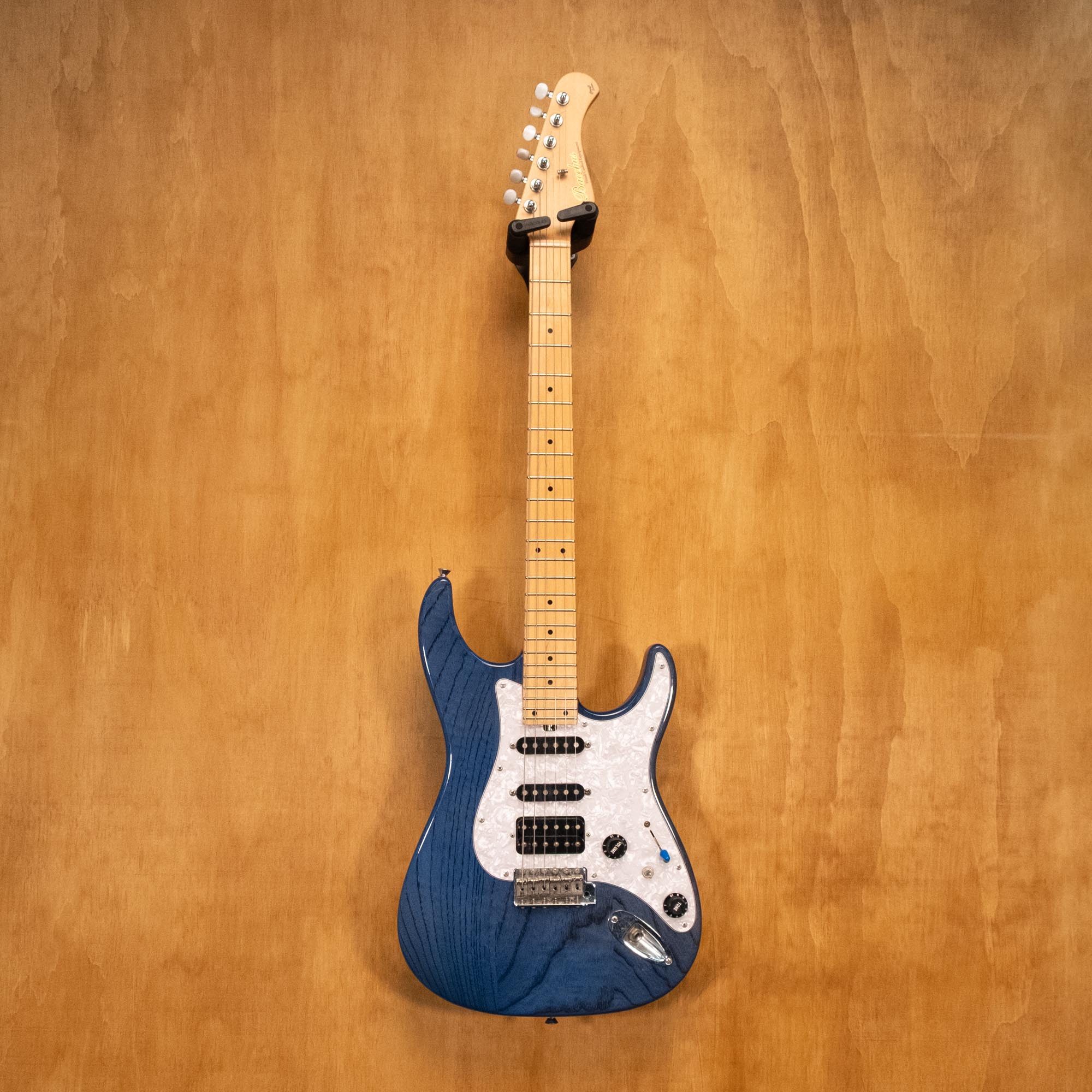 Bacchus Craft Series MIJ electric guitar with sunburst finish, maple neck, and chrome hardware, displayed on a stand.