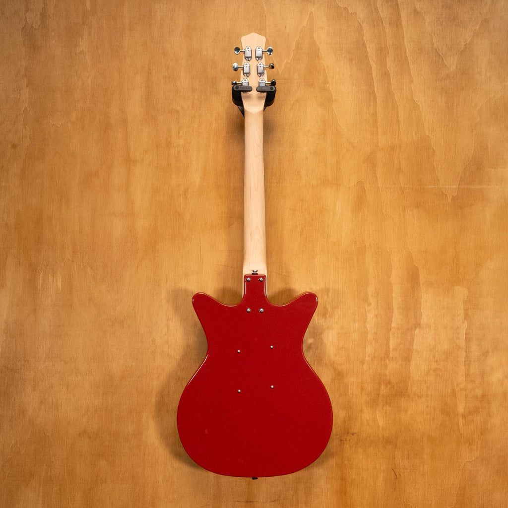 Danelectro Stock '59 electric guitar in red with vintage-style body and chrome hardware, shown in a close-up view.