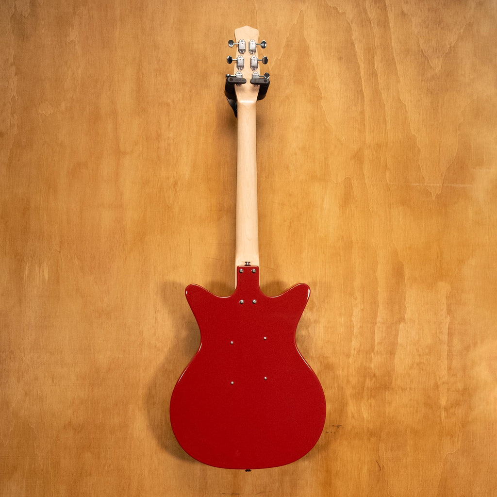 Danelectro Stock '59 electric guitar in red with vintage-style body and chrome hardware, showcasing its classic design and dual pickups.