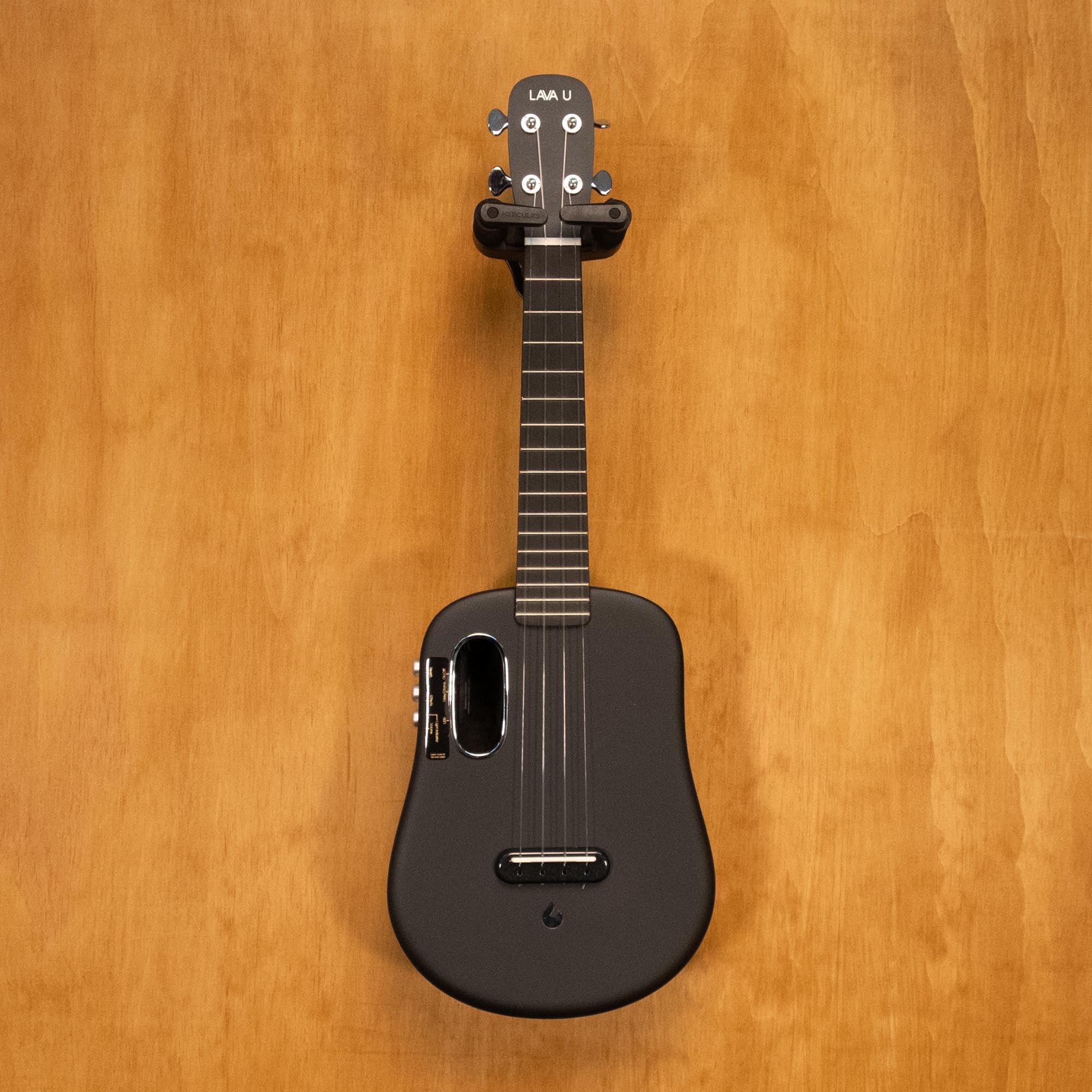 Preloved Lava U ukulele with hardcase, featuring a sleek wooden body and black tuning pegs, from Lava Music.