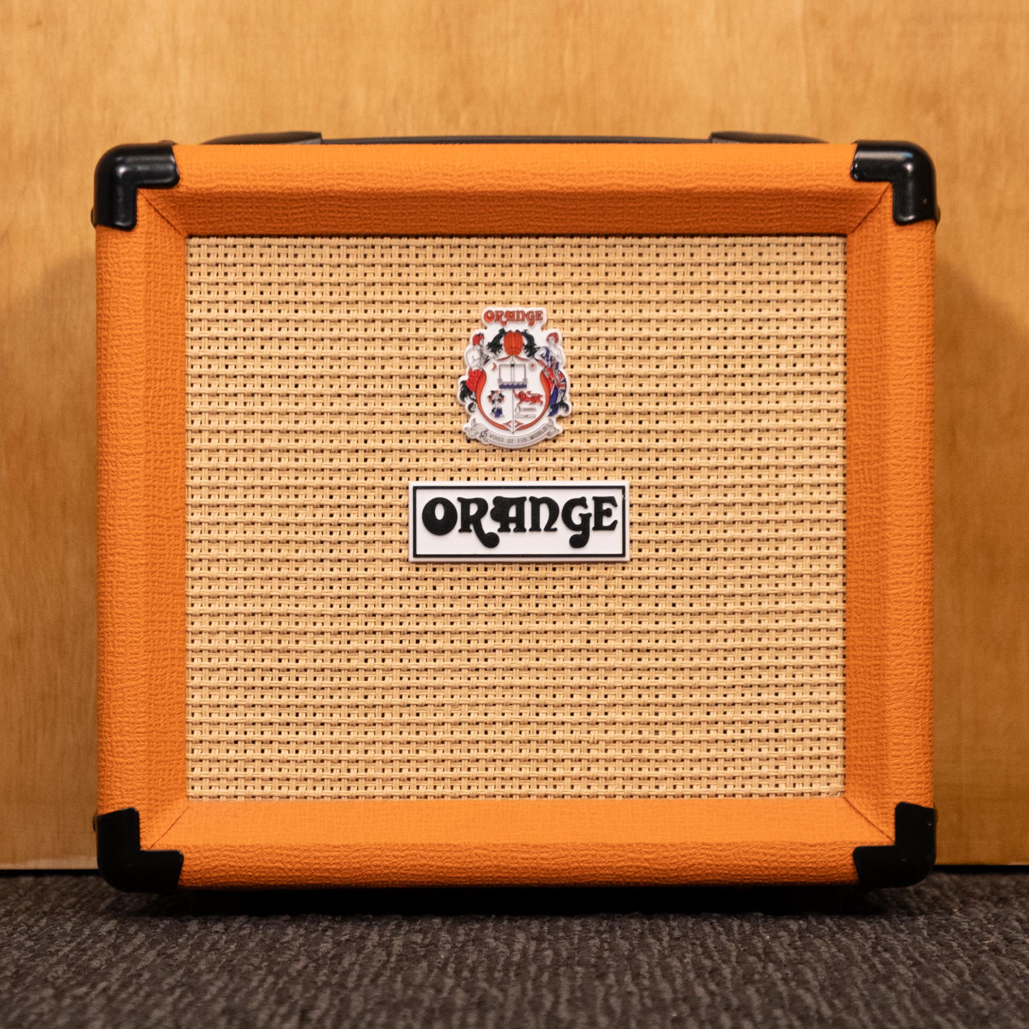 Orange Crush 12 guitar amplifier combo in orange with control knobs and speaker grille, compact and portable for practice.