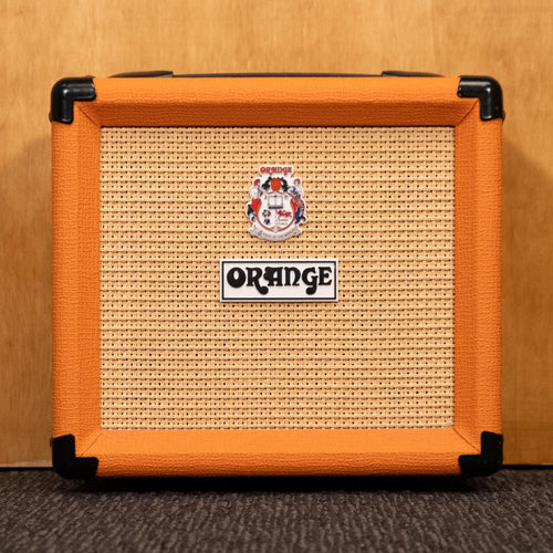 Orange Crush 12 guitar amplifier combo in orange with control knobs and speaker grille, compact and portable for practice.