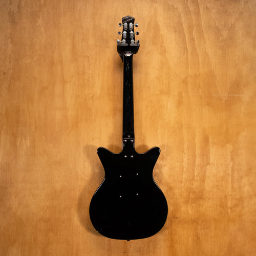 Danelectro '59M NOS electric guitar in black with a vintage-style body and chrome hardware, shown from a front angle.