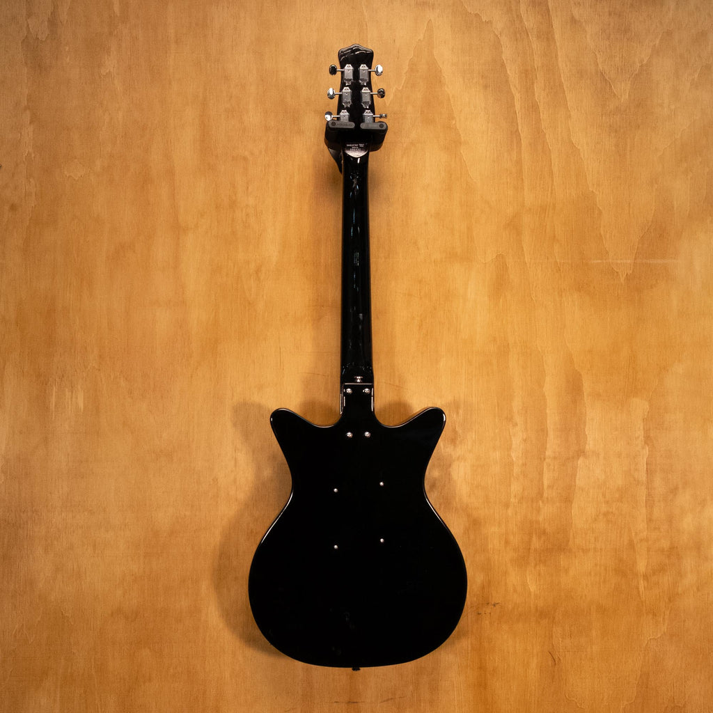 Danelectro '59M NOS electric guitar in black with vintage-style body and chrome hardware, shown on a plain background.