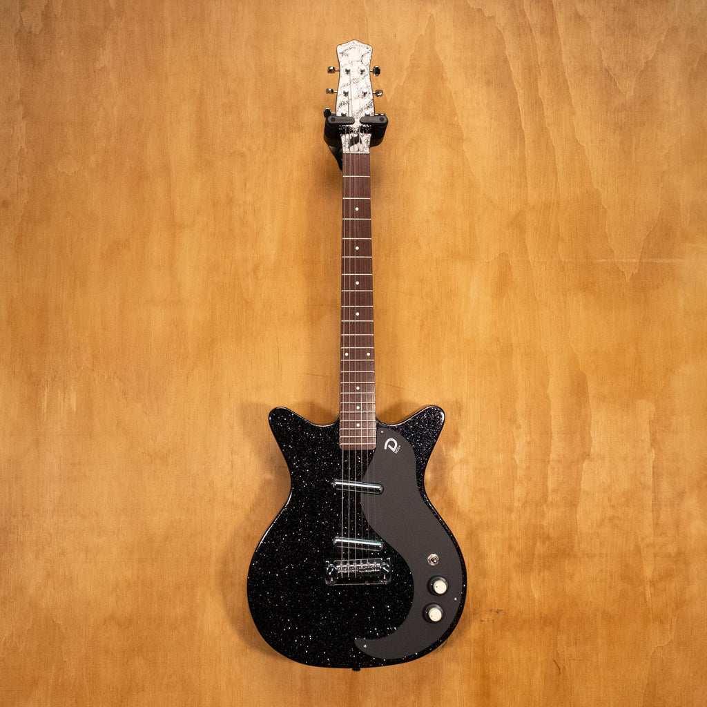 Danelectro '59 Blackout Black Metal Flake electric guitar with a sleek black finish and metallic flake detail, close-up view.