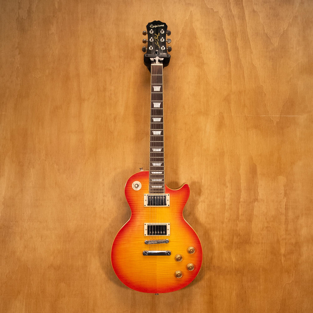 Epiphone Les Paul 1960 Tribute Pro electric guitar with sunburst finish and chrome hardware, close-up of body and pickups.