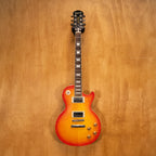 Epiphone Les Paul 1960 Tribute Pro electric guitar with sunburst finish and chrome hardware, close-up of body and pickups.