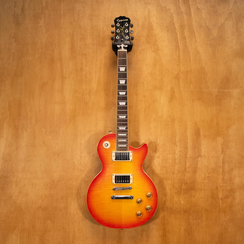 Epiphone Les Paul 1960 Tribute Pro electric guitar with sunburst finish and chrome hardware, close-up of body and pickups.