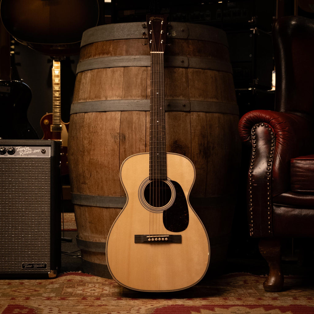 Martin Custom Shop Style-28 0-14 Adirondack/Cocobolo acoustic guitar with a rich wood finish and detailed craftsmanship.