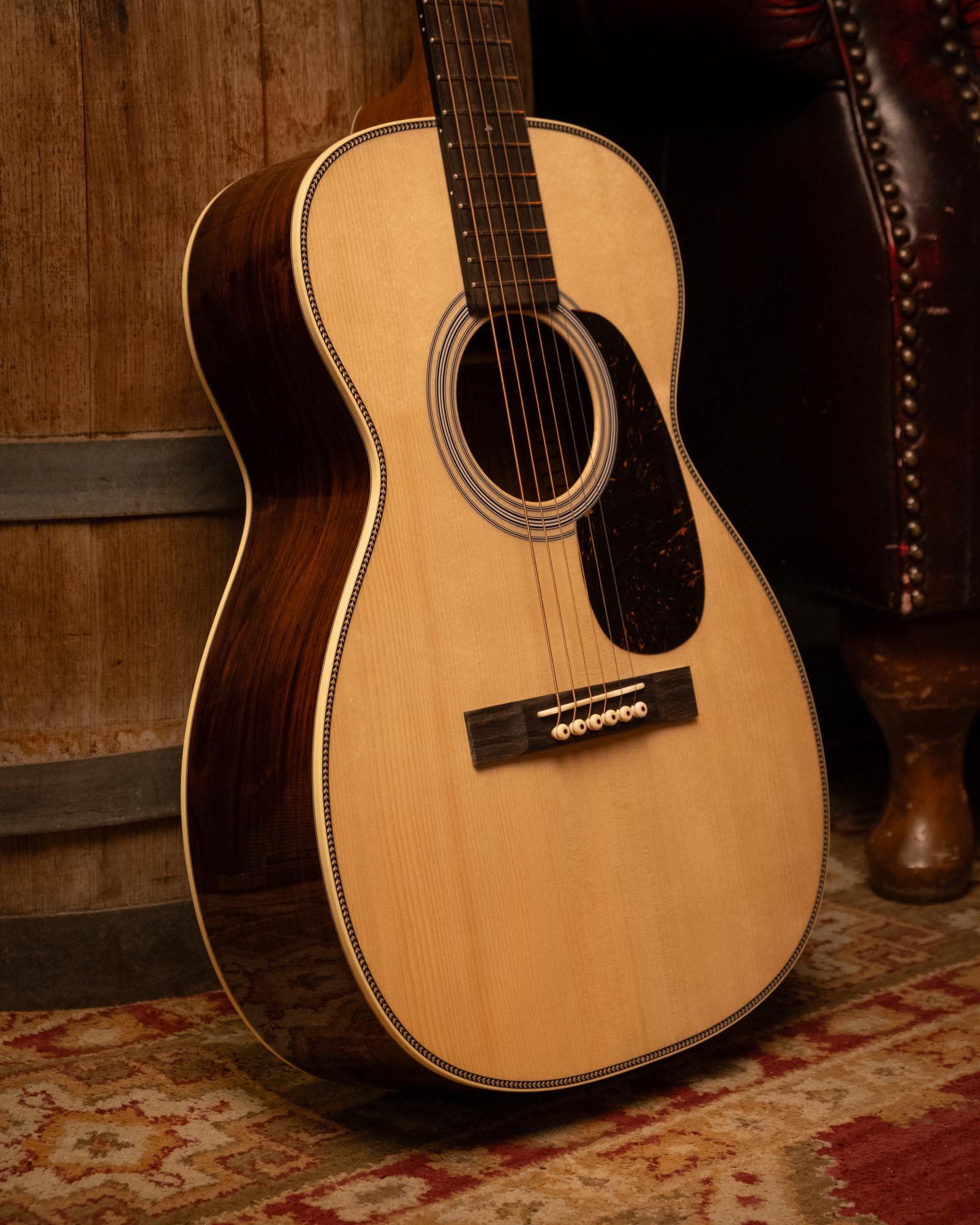 Martin Custom Shop Style-28 acoustic guitar with Adirondack top and Cocobolo back and sides, showcasing intricate wood grain details.