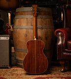Martin Custom Shop Style-28 acoustic guitar in Adirondack and cocobolo wood, showcasing its detailed craftsmanship and rich wood grain.